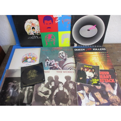 276 - A parcel of vintage 7 & 12 inch vinyl records, most by Queen but includes Beatles and Elton John, al... 