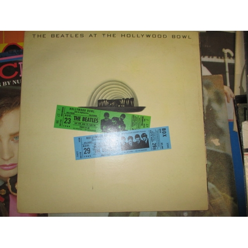 276 - A parcel of vintage 7 & 12 inch vinyl records, most by Queen but includes Beatles and Elton John, al... 