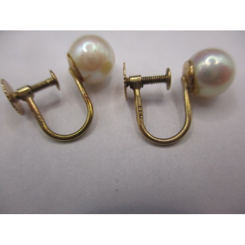 73 - Two pairs of 9ct gold screw-on earrings, each set with pearls, both in used condition