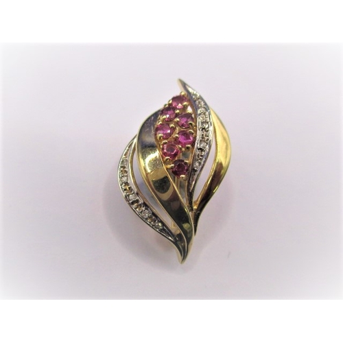 76 - A 9ct gold diamond and ruby brooch, approx. weight 3.9g in good pre-owned condition