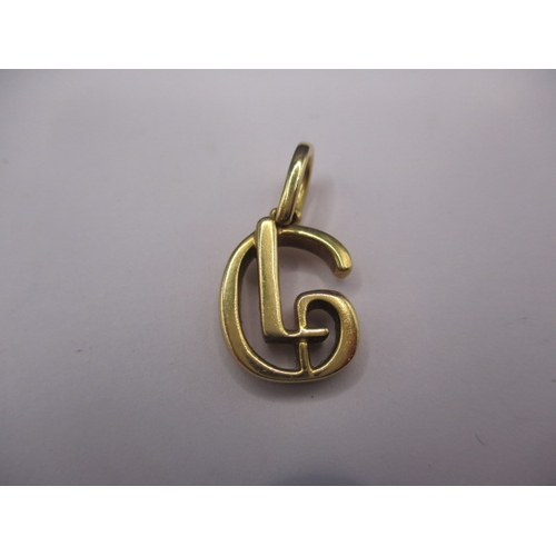 77 - An 18ct yellow gold necklace pendant, in the form of a stylised G, approx. weight 4g, in good pre-ow... 