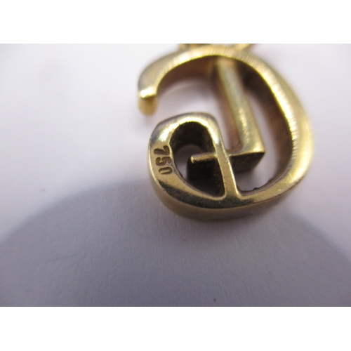 77 - An 18ct yellow gold necklace pendant, in the form of a stylised G, approx. weight 4g, in good pre-ow... 