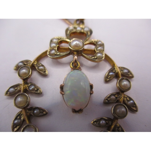 78 - A vintage 9ct gold necklace pendant, having hanging opal surrounded by a ring of seed pearls, approx... 