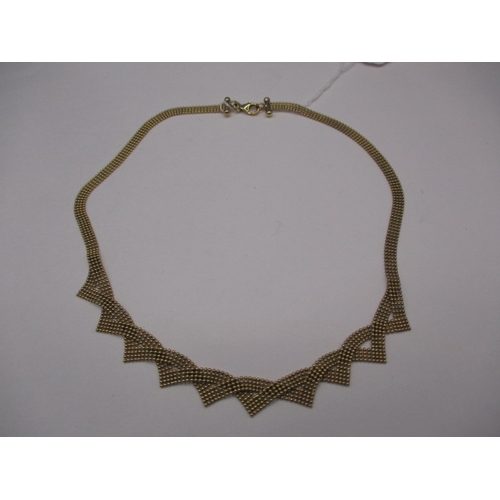 67 - A vintage 9ct gold choker style necklace, approximate weight 13.2g. In good used condition with work... 