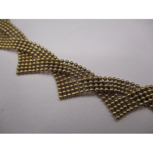 67 - A vintage 9ct gold choker style necklace, approximate weight 13.2g. In good used condition with work... 