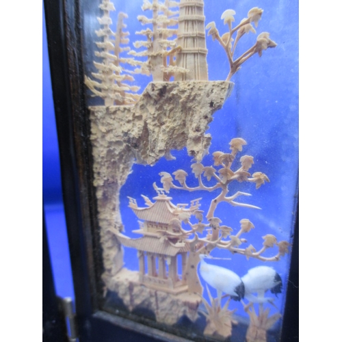 2 - A miniature 4 fold screen with carved wood panels, in good used condition, approx. height 17cm