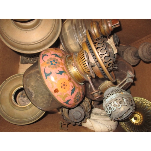 11 - A very large quantity of vintage oil lamps, shades and chimneys, all in used condition, some may hav... 