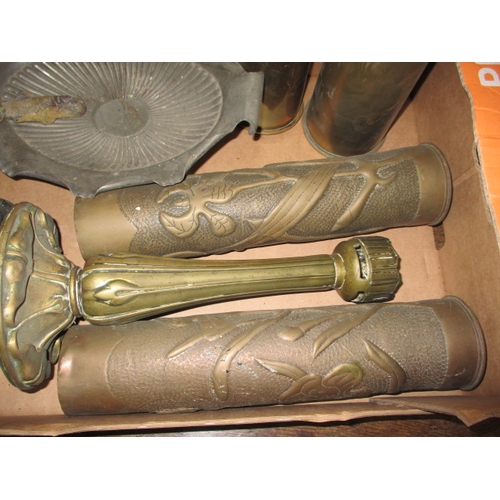 21 - A parcel of metalwares, to include WWI shell cases, cast iron wall sconces and vases, all in used co... 