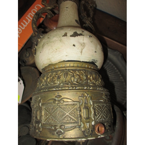 21 - A parcel of metalwares, to include WWI shell cases, cast iron wall sconces and vases, all in used co... 