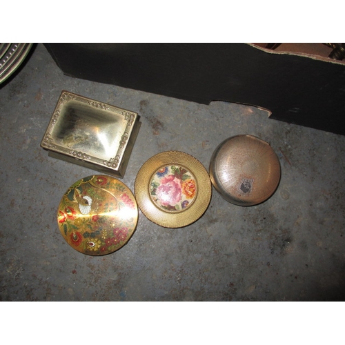 27 - A parcel of miscellanea to include horse brasses and powder compacts, all in used condition