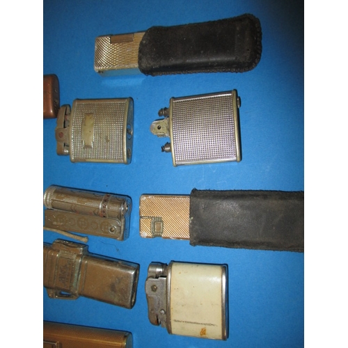 33 - A parcel of vintage cigarette lighters, various makers, all with use-related marks, none tested as t... 