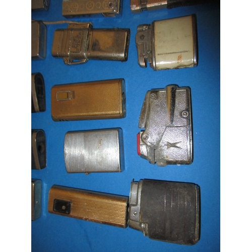 33 - A parcel of vintage cigarette lighters, various makers, all with use-related marks, none tested as t... 