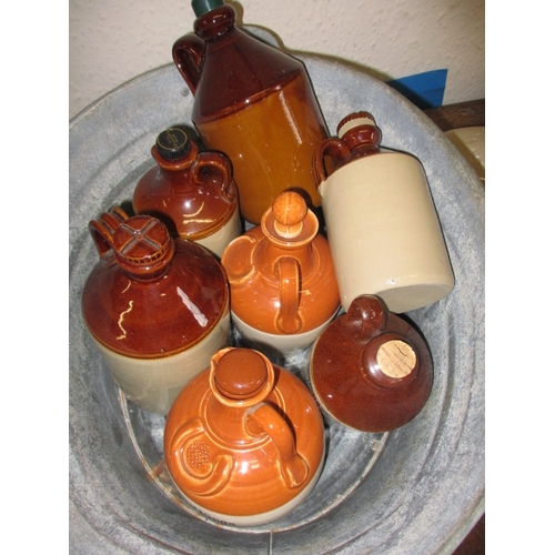 43 - Two vintage galvanised bath tubs and a quantity of stoneware water bottles and jugs, all in used con... 