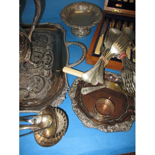 46 - A parcel of silver plated items, to include a tea set on tray and assorted cutlery, all in used cond... 