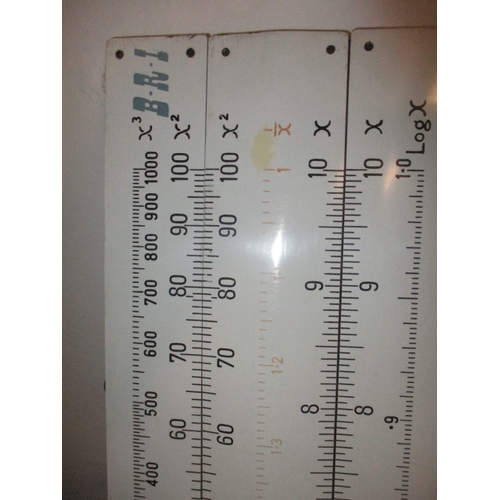 70 - A large teaching aid slide rule, approx. length 156cm and a surveyors level in wood box, both in use... 