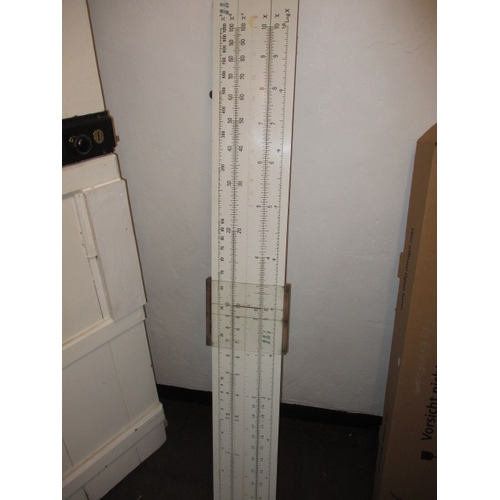 70 - A large teaching aid slide rule, approx. length 156cm and a surveyors level in wood box, both in use... 