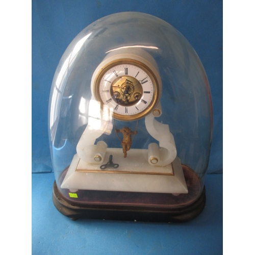 74 - An antique alabaster clock with swinging cherub pendulum, under original glass dome, dome in good co... 