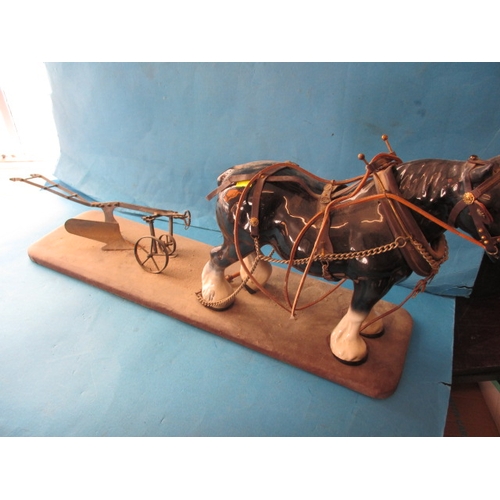 77 - A vintage model of a shire horse with plough, approx. length 48cm in need of refurbishment