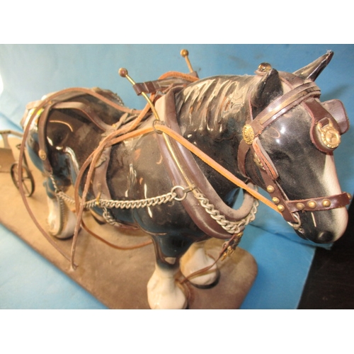 77 - A vintage model of a shire horse with plough, approx. length 48cm in need of refurbishment