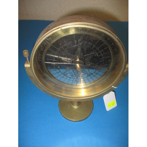 87 - A brass desk top compass, with swing head and shaving mirror to reverse side, approx. diameter 15cm,... 