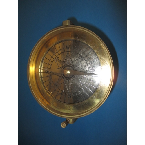 87 - A brass desk top compass, with swing head and shaving mirror to reverse side, approx. diameter 15cm,... 