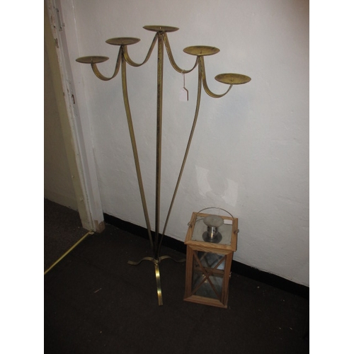 88 - A floor standing 5 branch candle holder and a large hanging lantern example, both in good used condi... 