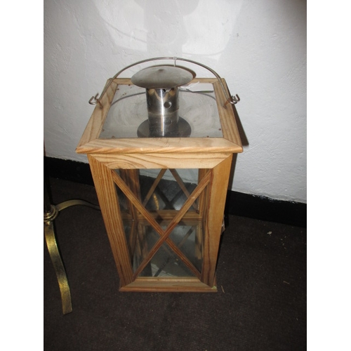 88 - A floor standing 5 branch candle holder and a large hanging lantern example, both in good used condi... 