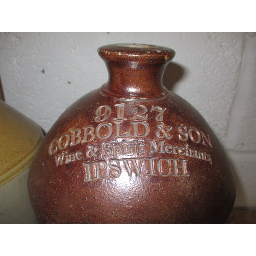 100 - Two vintage stoneware bottles, both in good condition