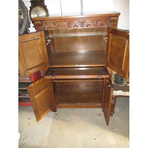 102 - A vintage oak cocktail cabinet, with glass racks, bottle cupboard and mixing slide, approx. size: H ... 