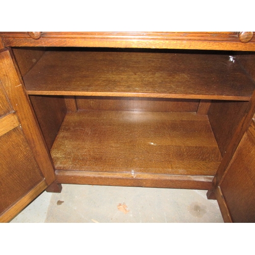 102 - A vintage oak cocktail cabinet, with glass racks, bottle cupboard and mixing slide, approx. size: H ... 