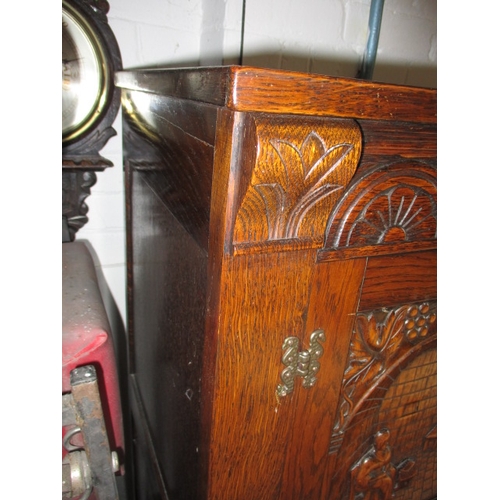 102 - A vintage oak cocktail cabinet, with glass racks, bottle cupboard and mixing slide, approx. size: H ... 