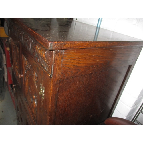 102 - A vintage oak cocktail cabinet, with glass racks, bottle cupboard and mixing slide, approx. size: H ... 