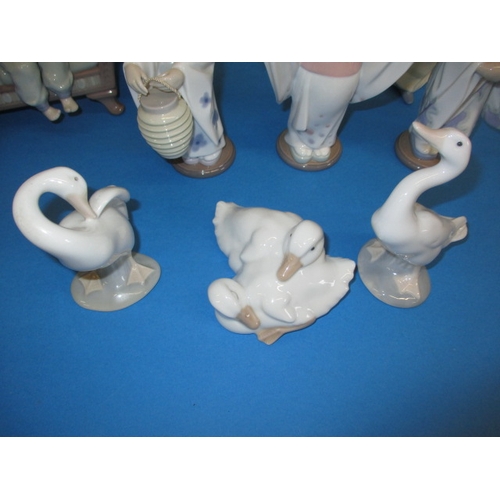 107 - A parcel of vintage Lladro porcelain figures, all in good condition with no observed damage  or rest... 