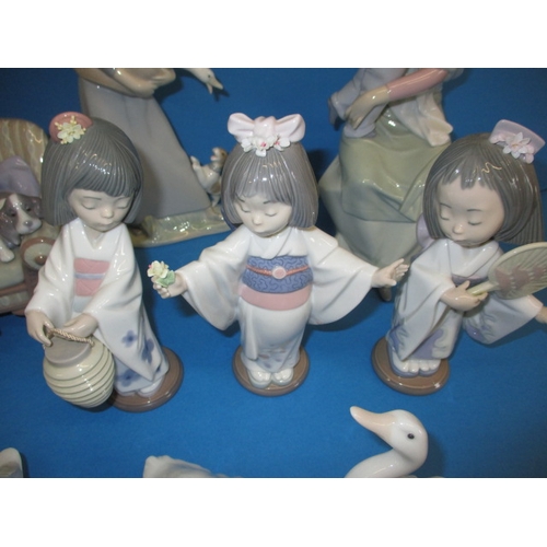 107 - A parcel of vintage Lladro porcelain figures, all in good condition with no observed damage  or rest... 