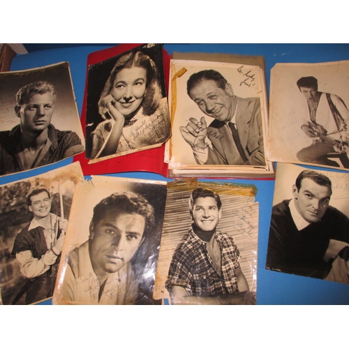 116 - A parcel of vintage film star press relace photos, some autographed, to include Richard Burton, Mart... 