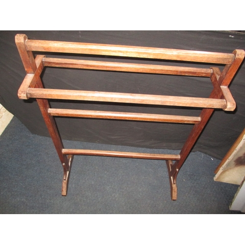 125 - An early 20th century stained beech towel rail, in good used condition