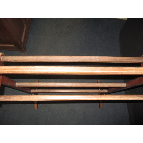 125 - An early 20th century stained beech towel rail, in good used condition