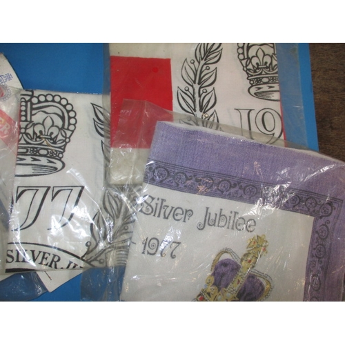 127 - A parcel of royal commemorative collectables to include silver jubilee t-shirts and coins, all in go... 