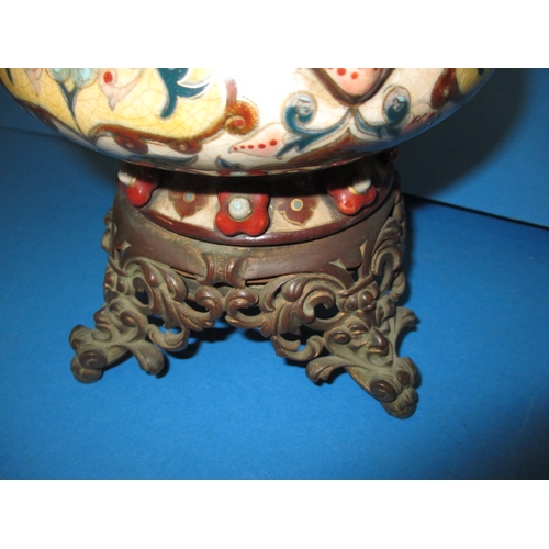 128 - A late 19th century oil lamp body with Duplex twin burner, having a floral design ceramic and brass ... 