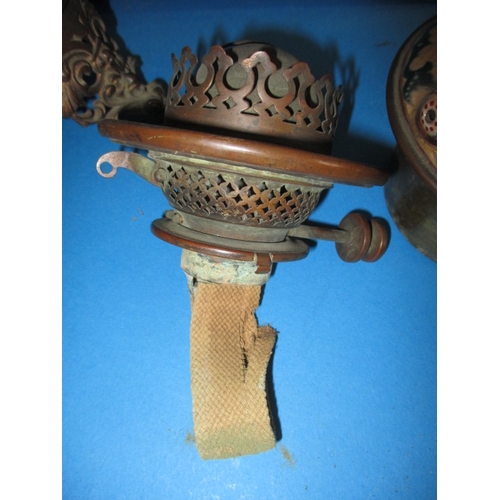 128 - A late 19th century oil lamp body with Duplex twin burner, having a floral design ceramic and brass ... 