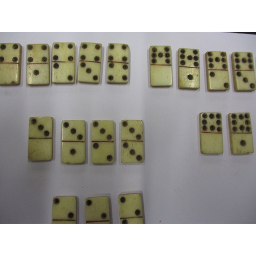 131 - 20 Vintage hand cut bone dominos, each measuring approx. 2cm x 1cm, in good used condition