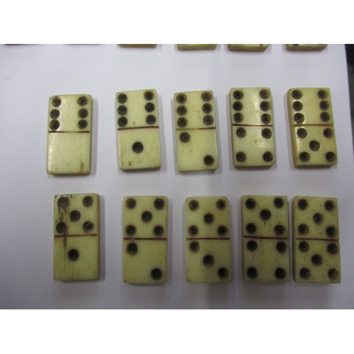 131 - 20 Vintage hand cut bone dominos, each measuring approx. 2cm x 1cm, in good used condition