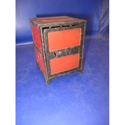 133 - A vintage  steel money box in the form of a safe, with key and use-related marks