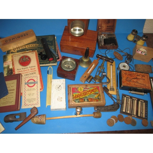 135 - A parcel of collectable items to include test meters, a corkscrew and coins, all in used condition