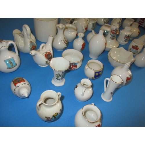 136 - A very large quantity of crested china, to include examples by Goss and Arcadian, all with no observ... 