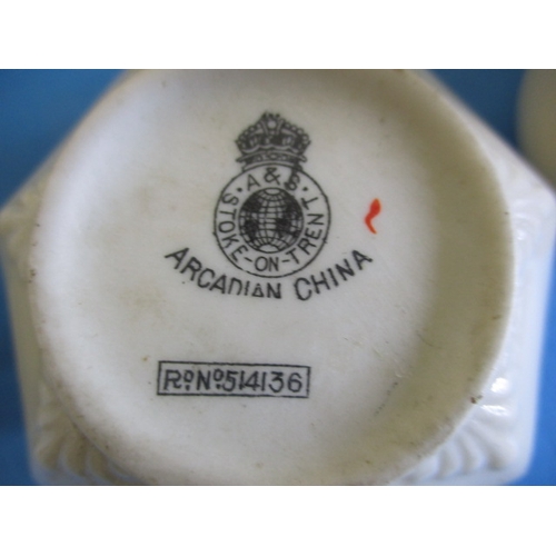 136 - A very large quantity of crested china, to include examples by Goss and Arcadian, all with no observ... 