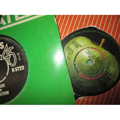 138 - A large quantity of 12 & 7 inch vinyl records, to include examples by the Beatles and Elvis, all in ... 