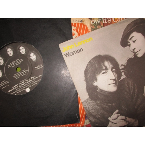 138 - A large quantity of 12 & 7 inch vinyl records, to include examples by the Beatles and Elvis, all in ... 