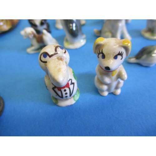 139 - A large collection of vintage miniature ceramic animals, most by Wade, all with no observed damage