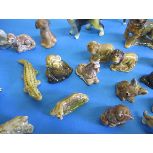 139 - A large collection of vintage miniature ceramic animals, most by Wade, all with no observed damage